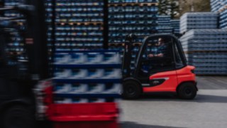 The X30 electric forklift truck is travelling quickly across an outdoor area.